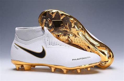 gold and white football boots